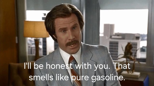 The image features an actor wearing a suit, standing next to a desk with a lamp. The text above him reads "I'll be honest with you... That smells like pure gasoline." This quote seems to be related to the movie "The Wolf of Wall Street" and is meant to convey the character's strong personality or sense of humor.