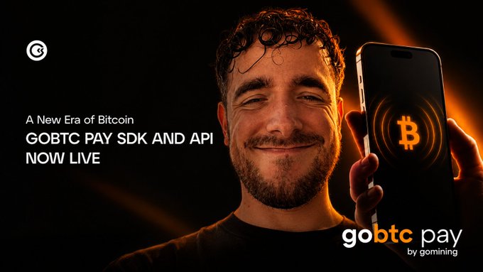 A promotional image for 'gobtc pay' by Goming, advertising 'A New Era of Bitcoin: GOBTC PAY SDK AND API NOW LIVE,' featuring a smiling man holding a smartphone displaying the Bitcoin logo.