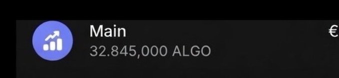 The image shows a rectangular black screen displaying an update of a "Main" button, with a symbol of a globe near the top left corner. The text at the bottom reads "Updated my $ALGO bag So far 32M soon 33M".