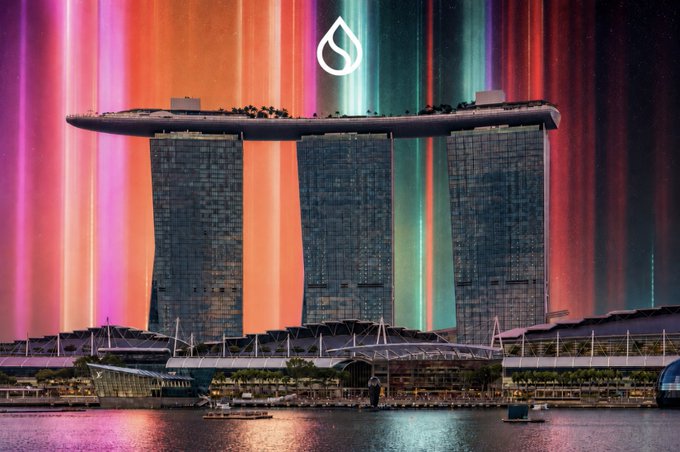 The Marina Bay Sands hotel in Singapore set against a vibrant, multicolored aurora-like sky with a white water drop logo superimposed at the top.