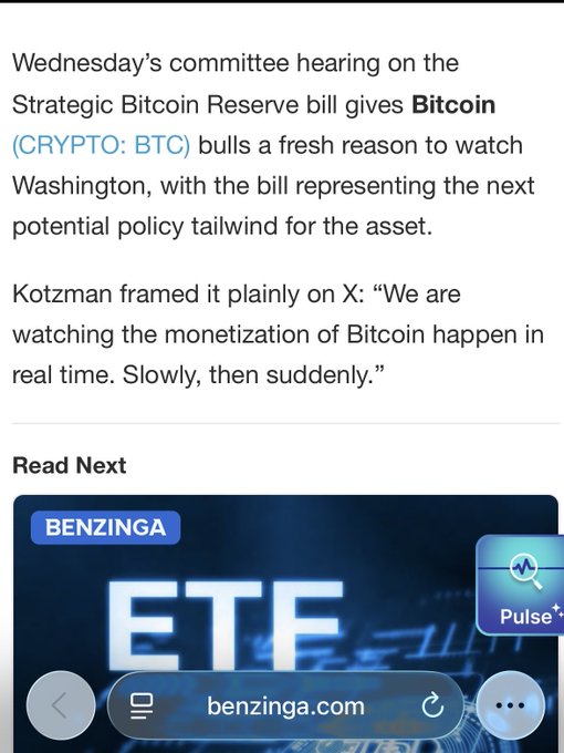 A mobile news article snippet from Benzinga discussing Wednesday's committee hearing on the Strategic Bitcoin Reserve bill, quoting Kotzman about Bitcoin monetization, with a Benzinga ETF promotional banner below.