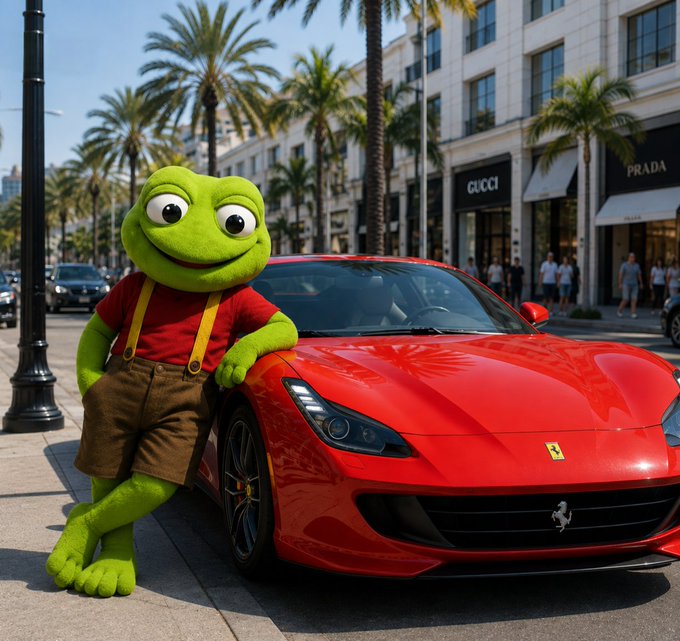 A green frog mascot in a red shirt and brown shorts leans casually against a red Ferrari on a luxury shopping street lined with palm trees and high-end storefronts, including visible signage for "GUCCI" and "PRADA" and the Ferrari prancing horse logo on the car. The image humorously illustrates the meme's punchline about $TOAD holders eventually pulling up in style after holding through mockery, turning the joke into a visual flex of unexpected success.