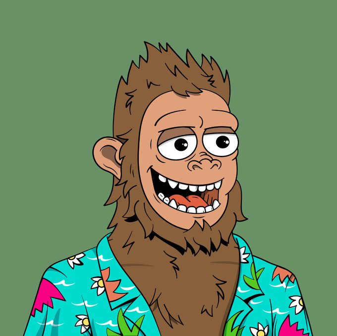 A cartoon illustration of a smiling monkey-like character with brown fur, big eyes, and a wide grin, wearing a turquoise Hawaiian shirt with white flower and green leaf patterns against a green background.