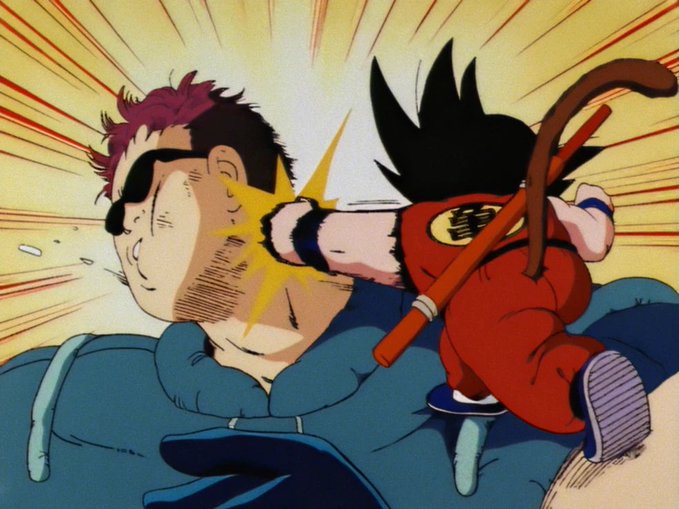 The image features a man wearing sunglasses, with his hair styled in a messy manner, and he's holding a stick or a sword. There are two other people in the scene - one person standing behind him and another person sitting next to him on a chair. The background of the image is filled with bright colors, giving it an energetic and dynamic feel. The post that accompanies this image reads: "$GOKU".