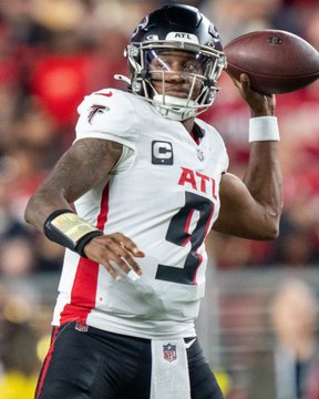 Atlanta Falcons quarterback Michael Penix Jr. (jersey #9) winds up to throw a pass during a game, visually supporting the post's claim that the Falcons are emerging as NFC South frontrunners behind their capable QB.
