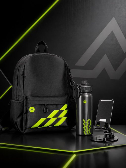 Product photo of a black backpack with neon green accents, a matching black water bottle, and a phone stand on a dark surface with green lighting, featuring an 'AA' logo.