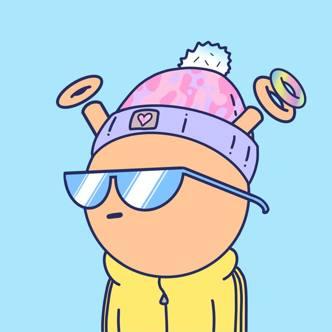 A cartoon character wearing a pink and purple patterned beanie with rings on its antennas, blue sunglasses, and a yellow hoodie stands against a blue background.