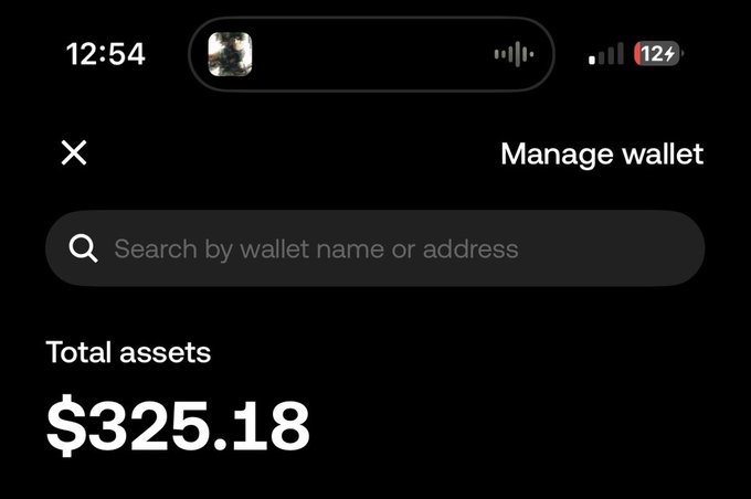 A mobile phone screenshot shows a dark-themed wallet app displaying 'Total assets' of $325.18, with a search bar and 'Manage wallet' option.