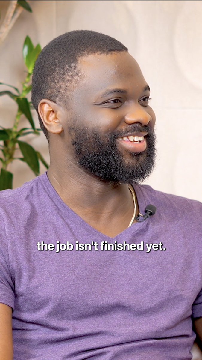 A bearded man in a purple v-neck shirt smiles during what appears to be a podcast or interview, with a lapel microphone clipped to his shirt and a plant visible in the background. The caption reads "the job isn't finished yet," visually reinforcing the post's message about Daya's continuous feedback loop and iterative product development.