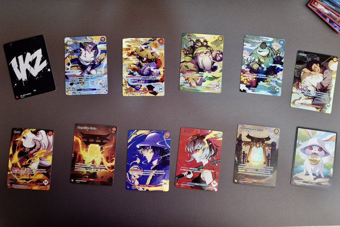 ikz cards are displayed on a table, including one that reads "IKZ Godpack".