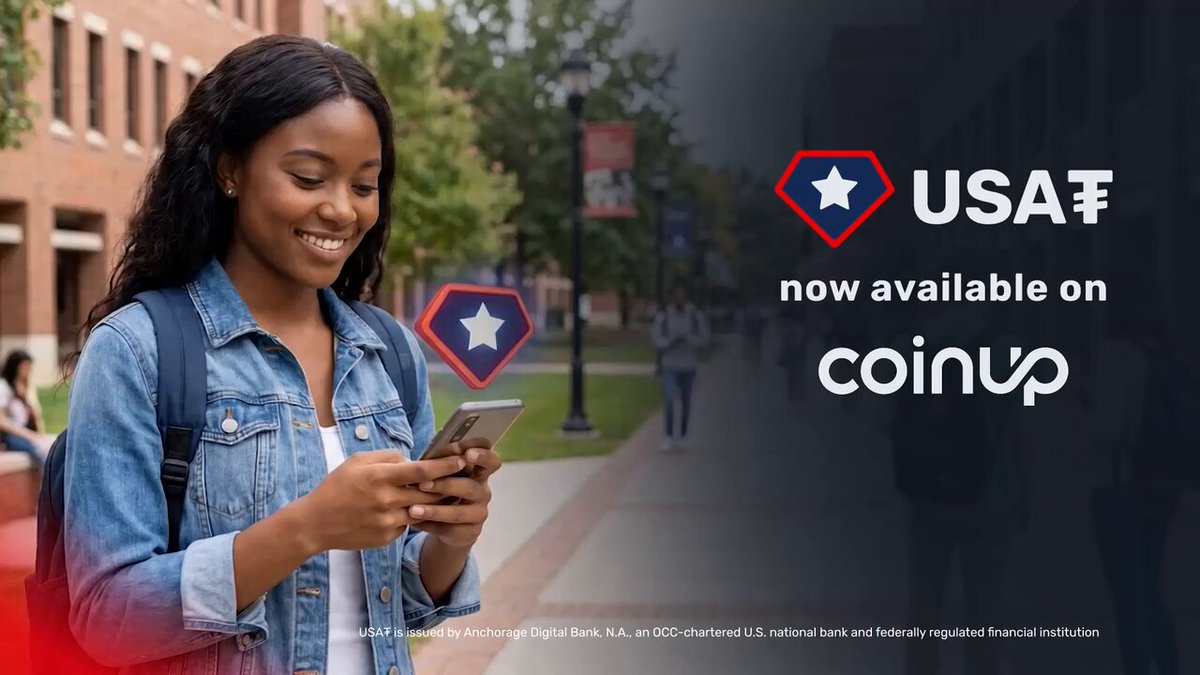 The image features a woman wearing a denim jacket, standing next to a building with trees behind her. She is holding a cell phone up to her face as she looks at the screen. The background of the image includes text that reads "USAF" and "CoinUp", suggesting that the woman might be using CoinUp for financial transactions or related services.