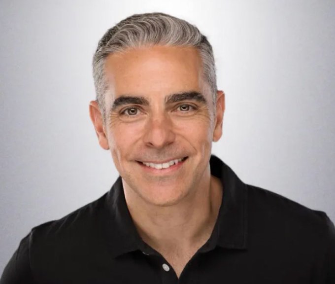 A headshot of a smiling middle-aged man with gray hair wearing a black polo shirt, pictured alongside a post emphasizing the urgent need for the Bitcoin and Crypto Clarity Act to establish clear U.S. regulatory rules and maintain America's leadership in the global financial system.