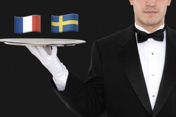 A waiter in a tuxedo holds a silver tray with French and Swedish flag emojis above it, symbolizing translation services between French and Swedish.