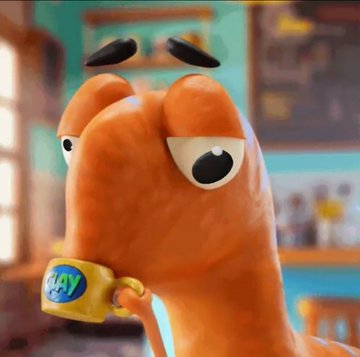 A 3D animated orange slug-like character with large eyes, black eyebrows, and a yellow wristband with a logo, set in a kitchen environment.