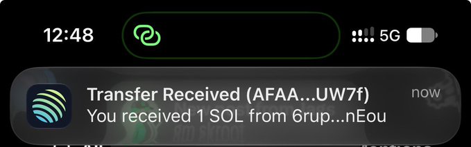 An iPhone lock screen notification showing the time 12:48, indicating a 'Transfer Received (AFAA...UW7f)' of 1 SOL from '6rup...nEou'.