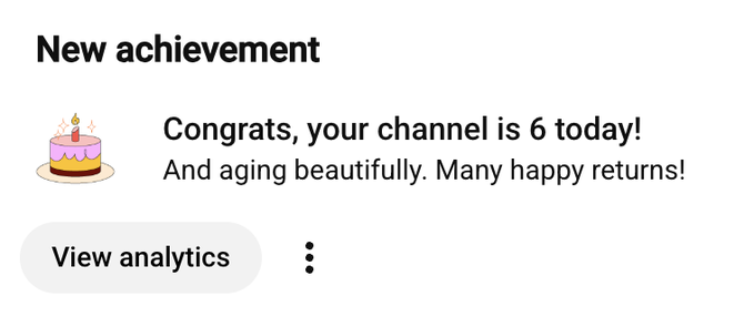 A YouTube notification reading 'New achievement: Congrats, your channel is 6 today! And aging beautifully. Many happy returns!' with a 'View analytics' button.
