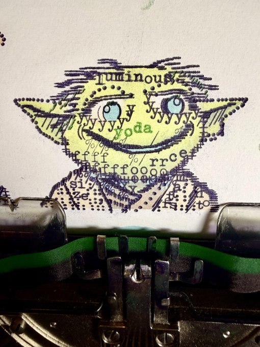A piece of paper fed into a vintage typewriter displays a typewriter art portrait of Yoda, created using various keyboard characters and filled with yellow-green color, with visible keys including 'yoda', 'fff', 'rrr', and 'g'.