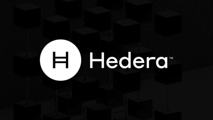 A Hedera branding image showing the white Hedera logo (an "H" in a circle) on a dark background with subtle 3D cube patterns, representing the Hedera distributed ledger platform.
