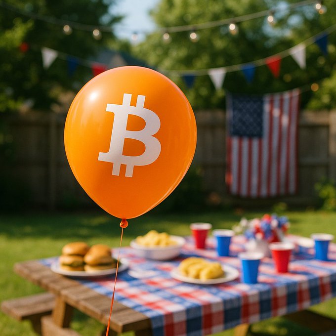An orange balloon featuring the Bitcoin "₿" logo floats in the foreground of a backyard 4th of July celebration, with a picnic table of burgers and snacks below, patriotic red, white, and blue bunting overhead, and an American flag hanging on the wooden fence in the background—perfectly capturing the festive "Happy 4th of July Bitcoin holders!" spirit by blending Bitcoin branding with classic Independence Day imagery.