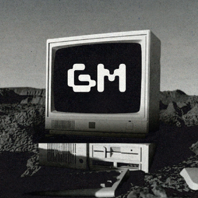 A vintage computer monitor sits atop a tower in a rocky, barren landscape, displaying the bold "GM" logo on its screen—a striking visual nod to General Motors (ticker: GM) for traders logging in.