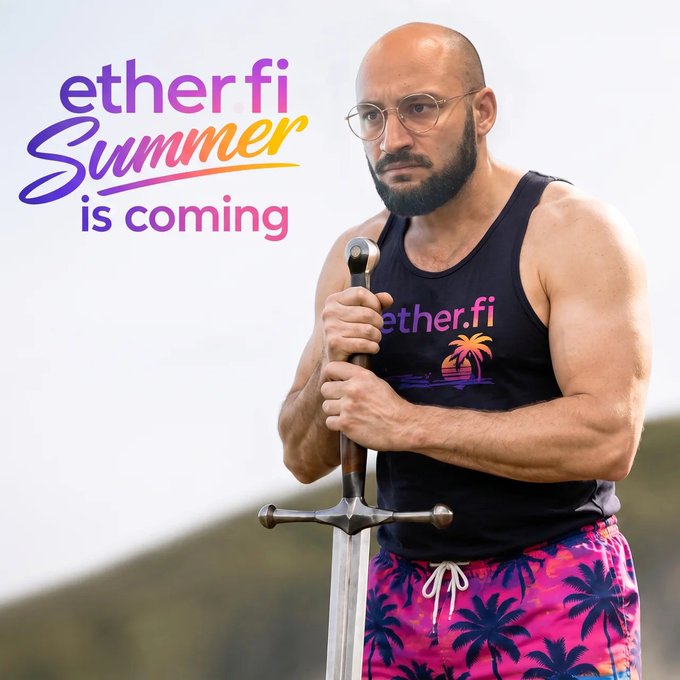 A man wears an "ether.fi" tank top with a sunset-palm graphic and bright palm-tree print shorts while holding a sword, accompanying the pun "ether.fi Summer is coming." The "fixed it" caption plays on the "Summer is coming" tagline, humorously framing the sword-wielding figure as ready to fix things.