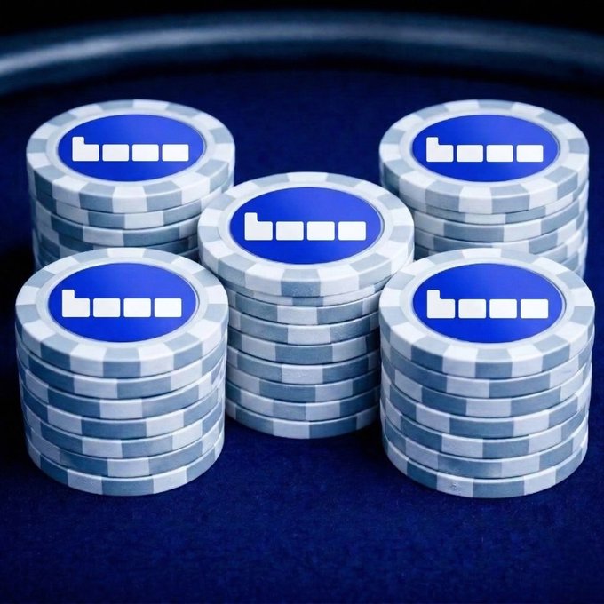 The image features five stacks of poker chips with blue and white designs, all neatly arranged on a dark blue surface. The text "base isn' just another blockchain" suggests that these poker chips are part of a larger project or initiative related to blockchain technology. This could be an innovative way of playing poker using smart contracts or a new method for managing digital assets in the gaming industry.