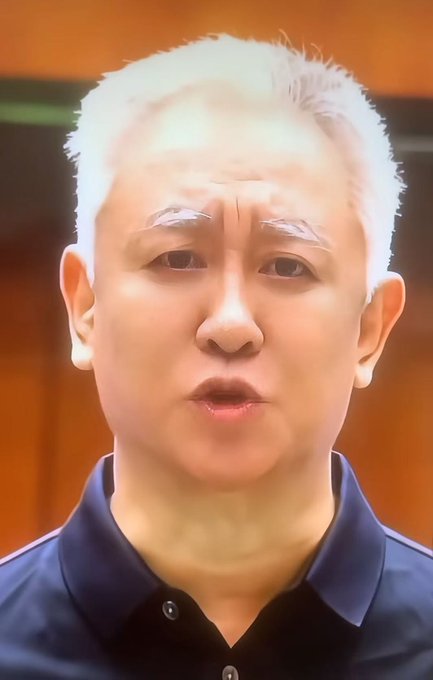 A middle-aged man with short white hair wearing a dark polo shirt appears to be speaking directly to the camera, with an intense expression that matches the serious tone of the message.

The accompanying post, referencing "coin poison" (likely cryptocurrency) and a debt of 2.4 trillion, suggests the man is delivering a warning or commentary about a financial figure with the surname Xu, whose father allegedly owes this massive amount.