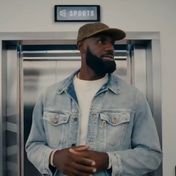 The image shows a bearded man wearing a denim jacket and a "New York Yankees" cap, standing in front of a doorway with an "EA SPORTS" sign above it. The accompanying post references LeBron James as a celebrity endorser for Polymarket, suggesting this could be LeBron or a similar figure, used to illustrate the celebrity endorsement comparison in sports betting marketing.