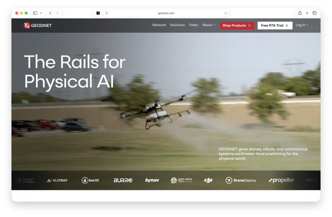 The image shows the newly launched GEODNET website homepage featuring the headline "The Rails for Physical AI" alongside an image of a drone spraying crops in a field, with the tagline stating "GEODNET gives drones, robots, and autonomous systems centimeter-level positioning for the physical world." The page includes navigation options like Shop Products and Free RTK Trial, along with partner logos including DJI, DroneDeploy, and Propeller.