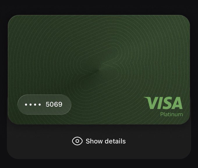A digital Visa Platinum card in dark green features a topographical line design with a subtle "S" emblem in the center, displaying the last four digits "5069" and a "Show details" option below, likely referencing the user's new card from SolidYield in the post about catching them all.
