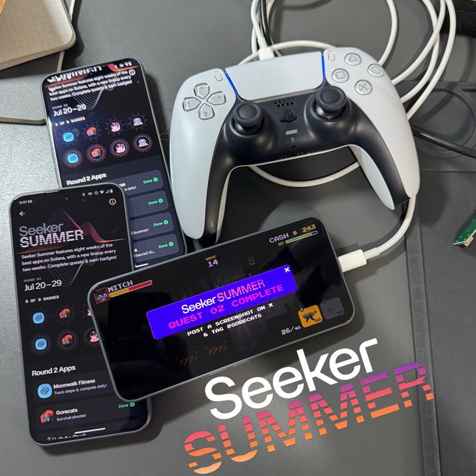 A promotional image titled 'Seeker SUMMER' shows three smartphones displaying app quest screens next to a white PlayStation 5 controller, with one phone showing 'QUEST 02 COMPLETE' and a 'Mitch' screen.