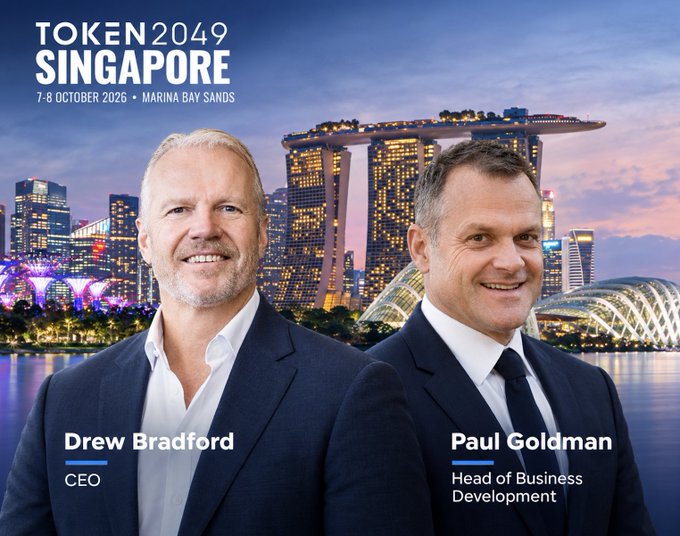 Promotional image for TOKEN2049 SINGAPORE (7-8 October 2026, Marina Bay Sands) featuring CEO Drew Bradford and Head of Business Development Paul Goldman against the Singapore skyline.