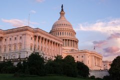 The U.S. Capitol building stands illuminated at sunset, symbolizing the legislative backdrop behind concerns about the Clarity Act's promised $600 million in funding for crypto law enforcement and whether that money will actually be available for its intended purpose.