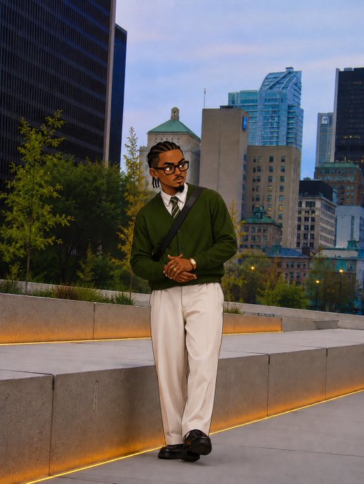 A stylish man in a green sweater and white pants poses against a city skyline at dusk.