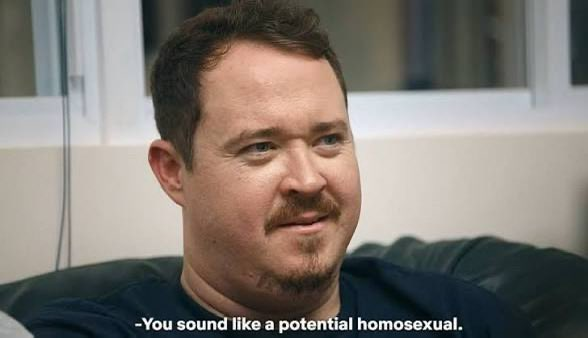 A man with a mustache is shown in a close-up shot, appearing to be mid-conversation, with the subtitle "-You sound like a potential homosexual." displayed at the bottom. The image appears to be a humorous reaction shot, commonly used in meme formats where the post jokes about a person unsuccessfully predicting market movements.
