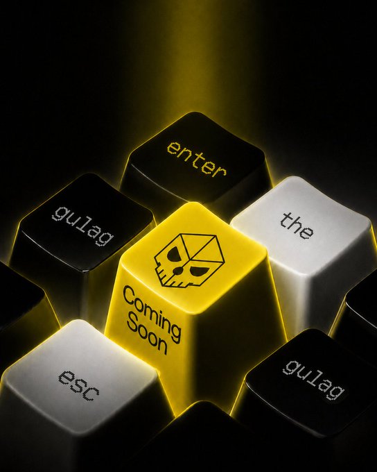 A 3D-rendered image of a glowing yellow keyboard key featuring a stylized skull logo and the text 'Coming Soon,' surrounded by black keys labeled 'enter,' 'the,' 'esc,' and 'gulag'.