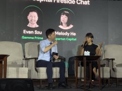 A panel discussion labeled 'Capital Fireside Chat' featuring Evan Szau (Germin8 Prime) and Melody Ho (Granite Capital) seated on stage.