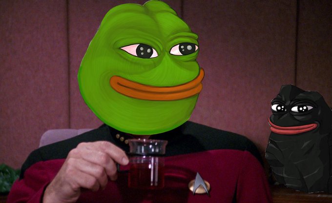 A man with a Pepe the Frog face mask holds a mug of dark liquid while wearing a Star Trek uniform, with another small black Pepe figurine beside him, matching the cheerful "good morning frens" meme vibe of the post.