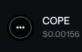 A small dark interface element showing 'COPE' with a price of '$0.00156' next to an ellipsis icon.