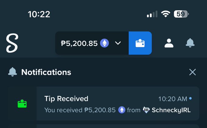 A mobile screenshot shows a notification from a tipping app confirming that ₱5,200.85 (approximately $100) was received from "SchneckyIRL" at 10:20 AM, with the account balance displayed as ₱5,200.85. This visual confirms the sender's post expressing thanks to SchneckyIRL for their $1000 50/50 buy, illustrating the successful crypto tip transaction.