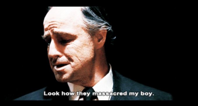A famous movie still of Marlon Brando as Don Corleone from The Godfather with the caption 'Look how they massacred my boy.'