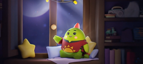 A cute cartoon green dinosaur plushie with a red belly design sits on a window seat with star-shaped pillows, surrounded by books and string lights at night.