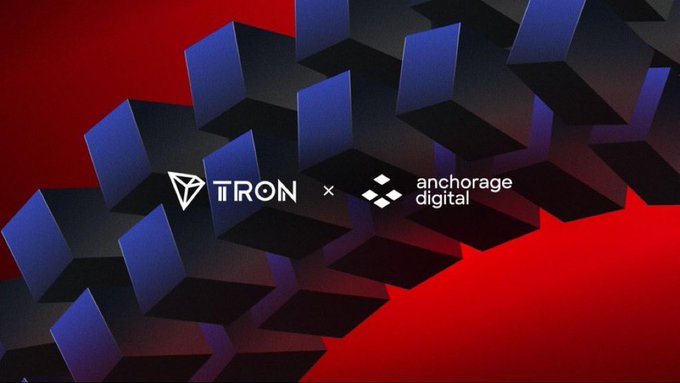 The image features the logos of TRON and Anchorage Digital side-by-side against a backdrop of blue 3D cubes on a red background, visually representing the partnership announcement. The composition symbolizes the collaboration between the two companies, with their branding prominently displayed to signify institutional support for the TRON ecosystem through Anchorage Digital's custody and staking services.