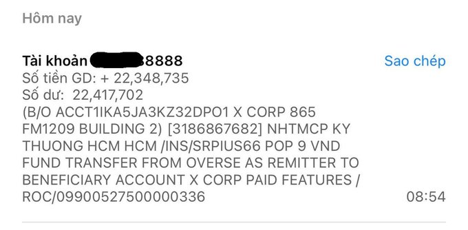 A Vietnamese banking transaction notification showing account information, a GD balance of +22,348,735 VND, and a transfer from X CORP for POP 9 VND.