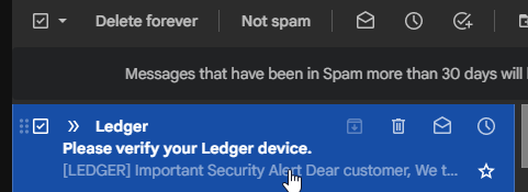A Gmail spam folder interface showing a message from Ledger with a security alert reading 'Please verify your Ledger device. [LEDGER] Important Security Alert Dear customer, We t...'