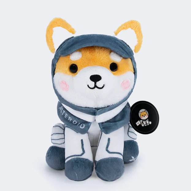 The image features a stuffed animal dog wearing a spacesuit, sitting next to a black circle with white text that reads "Asteroid Shiba plush toys, the official mascot of SpaceX", and a tag reading "$DOGE". The stuffed animal is positioned in front of a white background, making it stand out. The post suggests that Asteroid Shiba plush toys will be available for sale at the SpaceX store in September, possibly as part of their new product line or promotional campaign.