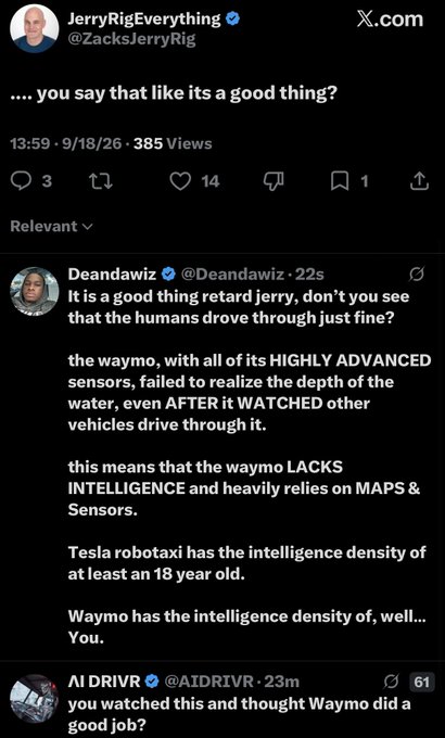 A screenshot of an X.com post exchange where @ZacksJerryRig asks 'you say that like its a good thing?' and @Deandawiz replies about Waymo's sensors failing to realize the depth of water.