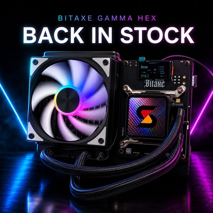 A Bitaxe Gamma Hex cryptocurrency mining device featuring six BM1370 ASICs and a vibrant RGB cooling fan, advertised as "BACK IN STOCK" with an integrated display showing the Bitaxe logo and technical readouts. The promotional image highlights the hydro-cooled, USA-assembled miner's sleek design against a neon-lit backdrop.