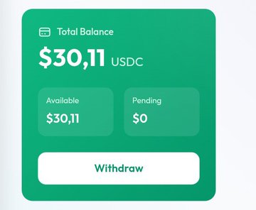 This image presents a screenshot of a dashboard from a platform called My Latest Clipur.com. The dashboard displays a total balance, available balance, and pending balance amounts that are $30.11 and $0 respectively, for the currency USDC. Additionally, there is an option to "Withdraw" in the bottom right corner. It appears that this platform might be related to money management or savings, as it provides users with information about their balances and how much they have earned on a given day.