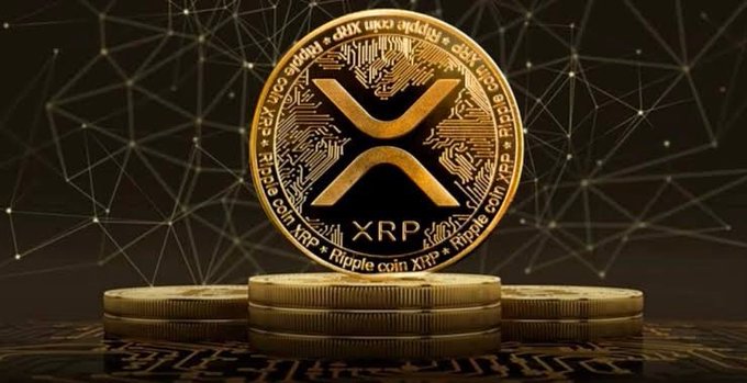 A golden XRP (Ripple coin) emblem rests atop stacked coins against a dark, web-like digital backdrop. The image accompanies a warning about a fake XRP staking scam that allegedly stole millions, emphasizing the need to verify crypto platforms before engaging.